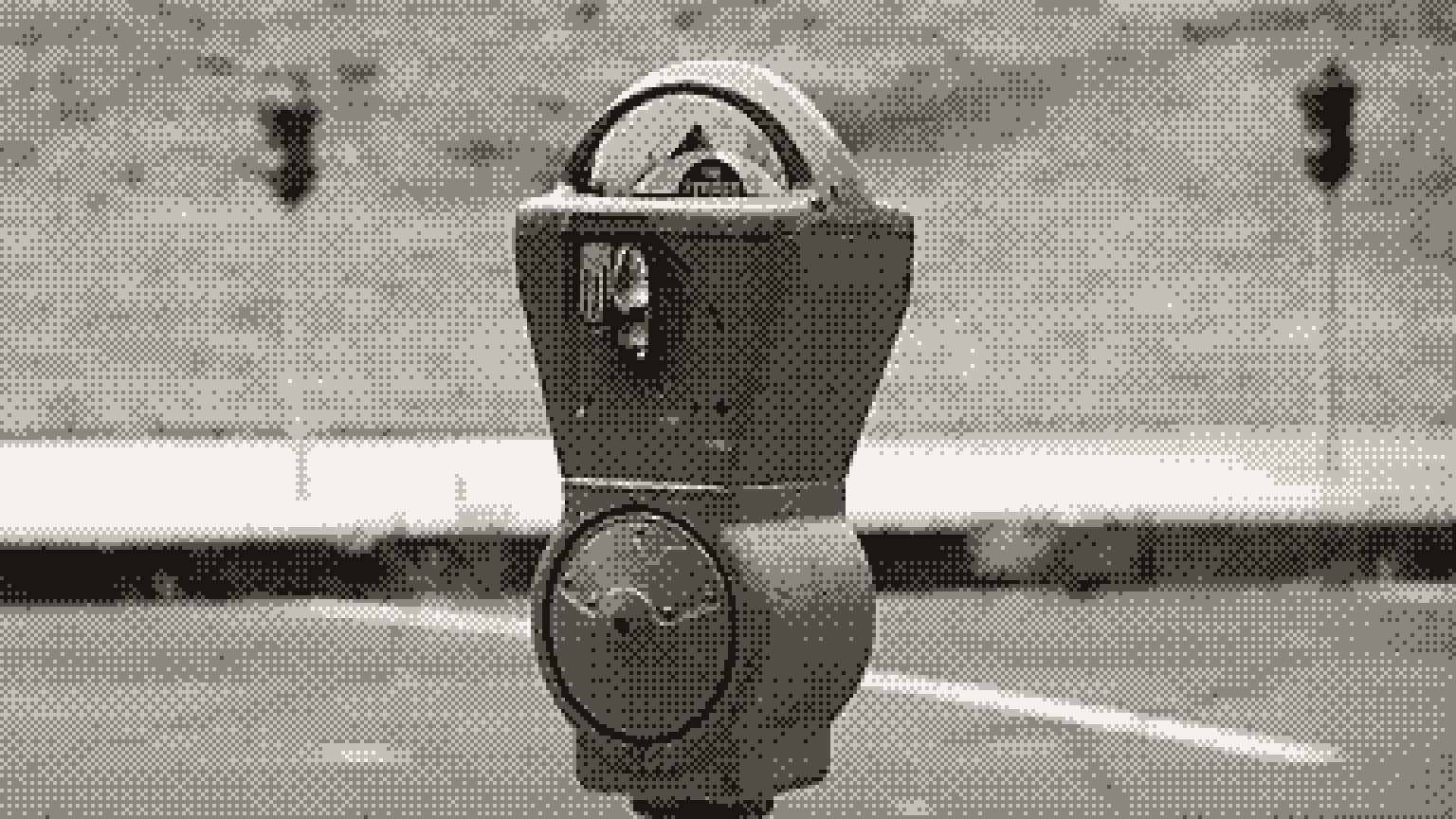 A coin-operated parking meter at the side of a road