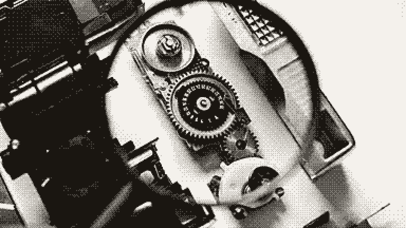 A magnifying glass held over the gears of a small machine